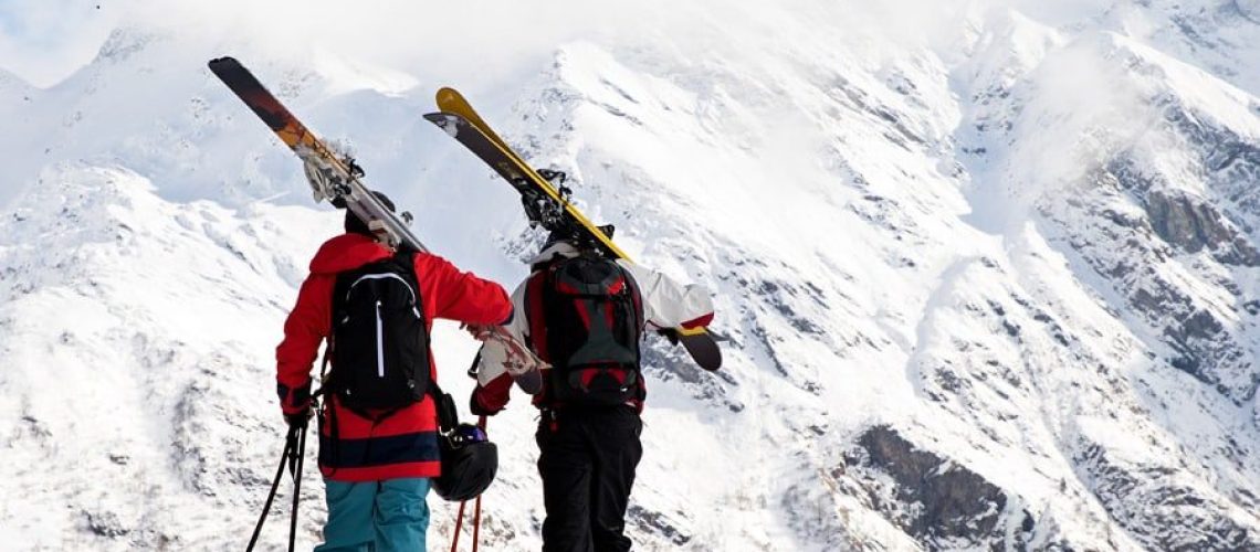 Ski buddies heading up towards big mountain slopes in the heart of Monte Rosa ski area